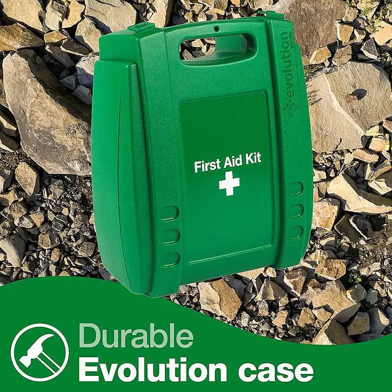Durable green first aid kit Evolution case on rocky ground, emergency medical supply box