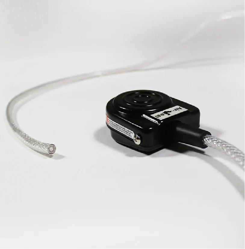 Medical footswitch with clear flexible tubing on a white background