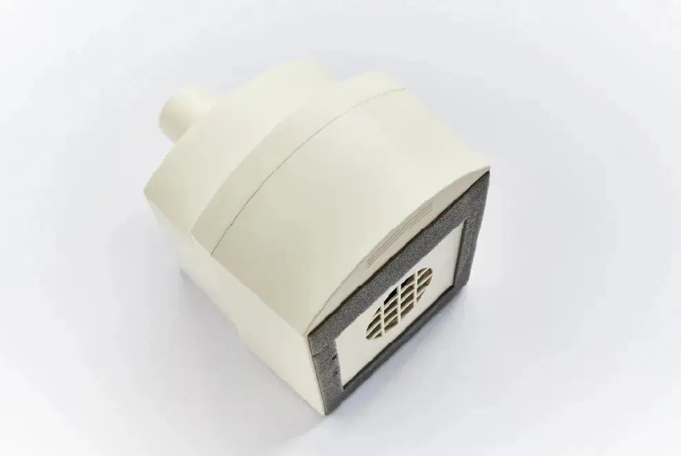 Schuco M1 main filter for Acu-Evac vacuum system, showing a compact filter with plastic housing and filter media inside.