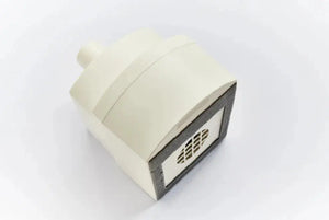 Schuco M1 main filter for Acu-Evac vacuum system, showing a compact filter with plastic housing and filter media inside.