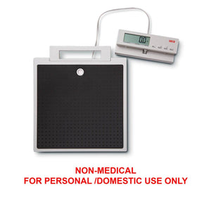 SECA 869 flat scales with cable remote display for non-medical use, featuring a large weighing platform and digital readout.