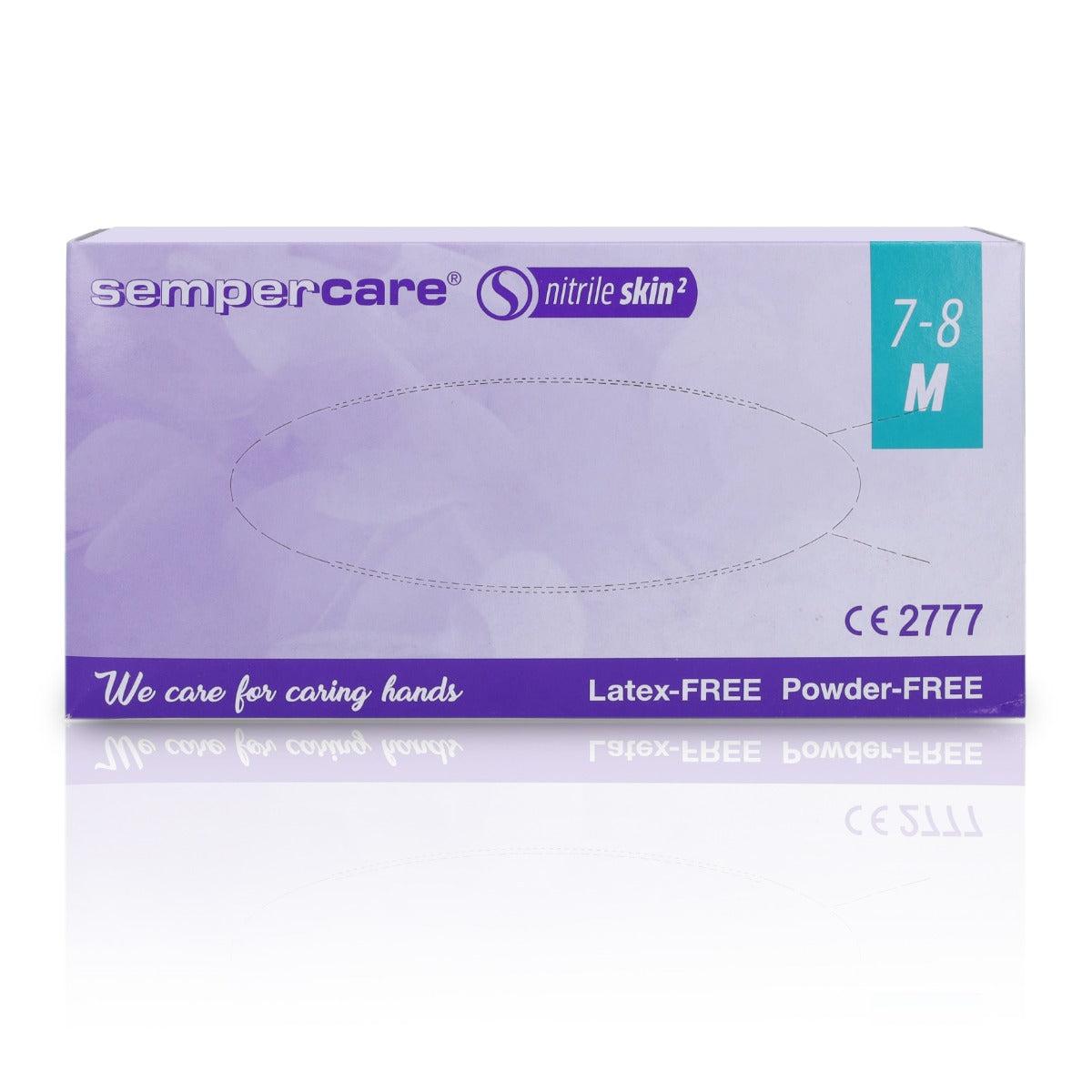 Pair of SemperMed Skin2 nitrile gloves in medium size, showing the textured surface and snug fit.