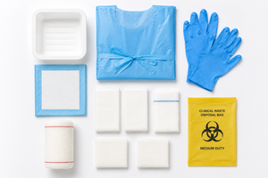 Sterile Vena Cava wound care dressing pack with apron, nitrile gloves, and forceps for safe medical procedures