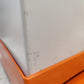Orange 28-litre hybrid sackholder with lid and base by Wybone, featuring a sturdy design and easy waste disposal.