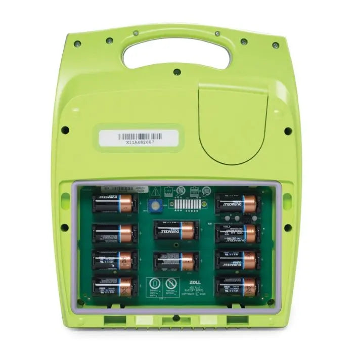 Open back of a Zoll AED Plus showing installed batteries and battery compartment