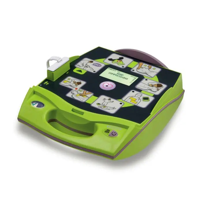 Green portable defibrillator with step-by-step CPR and AED instructions on its surface.